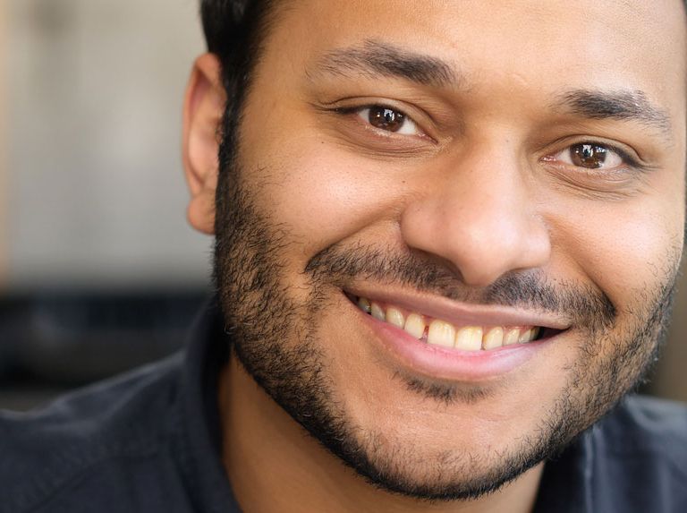 Cheerful serene hindu man smart casual hero 768x573