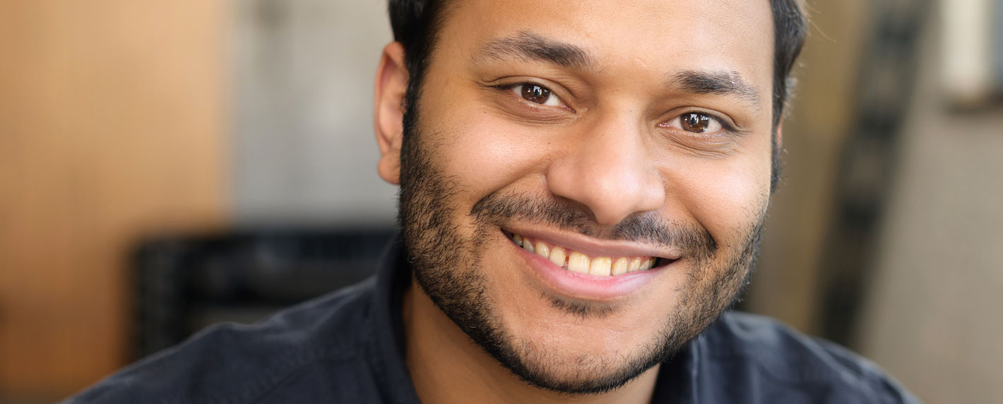 Cheerful serene hindu man smart casual hero